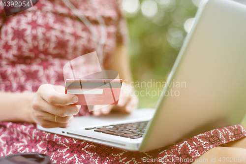 Image of Anonymous woman shopping in Internet