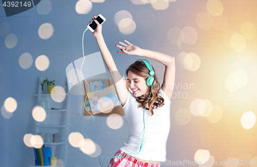 Image of happy woman in headphones ihaving fun at home
