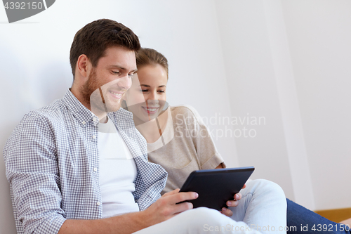 Image of happy couple with tablet pc computer