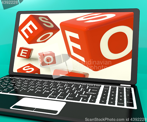 Image of Seo Dice On Laptop Showing Online Web Optimization