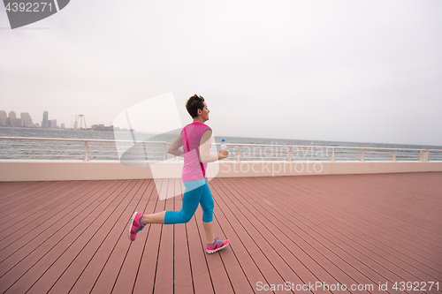 Image of woman running on the promenade