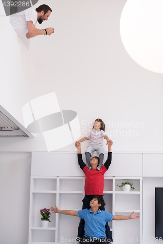 Image of young boys posing line up piggyback