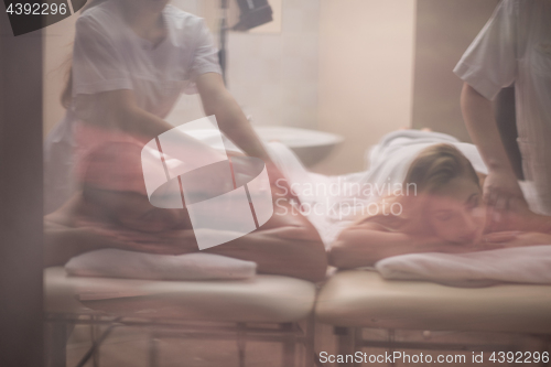 Image of couple receiving a back massage