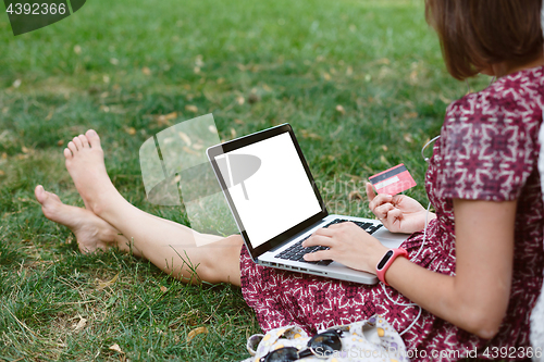 Image of Anonymous woman shopping in Internet