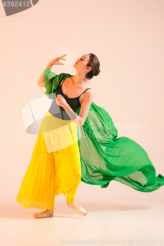 Image of Young and incredibly beautiful ballerina is dancing at studio