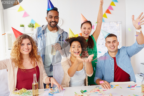 Image of happy team having fun at office party