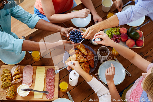 Image of group of people having breakfast at table