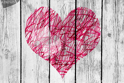 Image of Abstract heart with messy pattern on old wooden wall