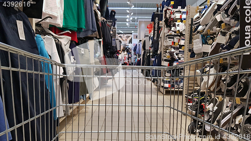 Image of Shopping cart in clothing retail shop