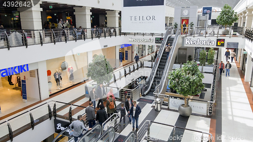 Image of People in escalators in a  modern shopping centre