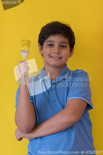 Image of Portrait of a happy young boy painter