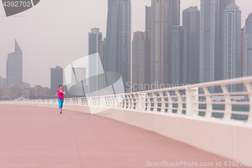 Image of woman running on the promenade