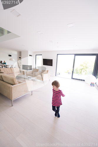 Image of family with little girl enjoys in the modern living room