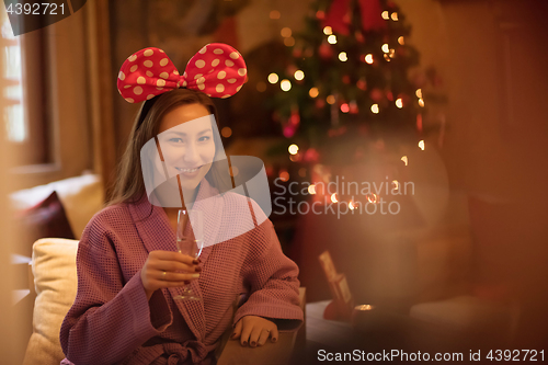 Image of woman drinking champagne at spa