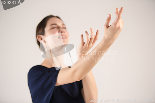 Image of Young and incredibly beautiful ballerina is dancing at studio