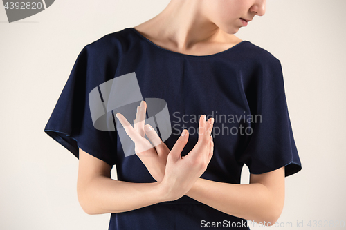 Image of Young and incredibly beautiful ballerina is dancing at studio