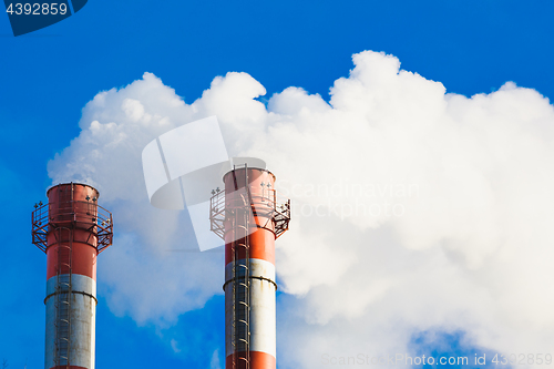 Image of Stream of dark smoke from the chimney of factory