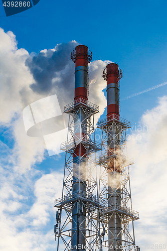 Image of Stream of dark smoke from the chimney of factory