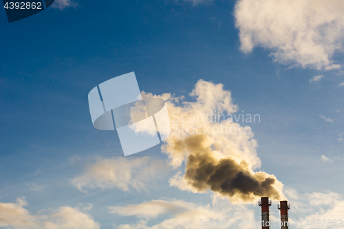 Image of Stream of dark smoke from the chimney of factory