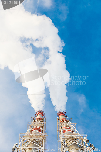 Image of Stream of dark smoke from the chimney of factory