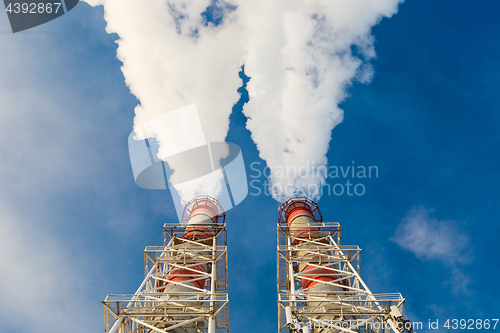 Image of Stream of dark smoke from the chimney of factory