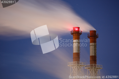 Image of Stream of dark smoke from the chimney of factory