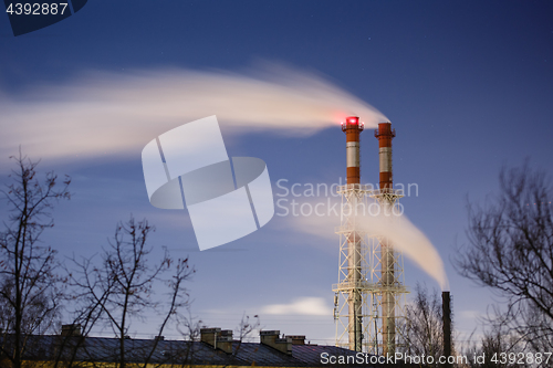 Image of Stream of dark smoke from the chimney of factory