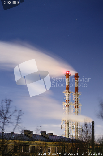 Image of Stream of dark smoke from the chimney of factory