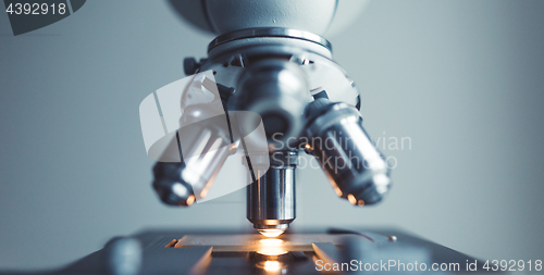 Image of Close up of examining of test sample under the microscope