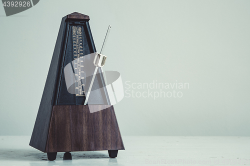 Image of Color shot of a vintage metronome