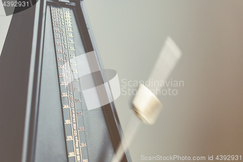 Image of Color shot of a vintage metronome