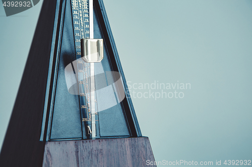 Image of Color shot of a vintage metronome