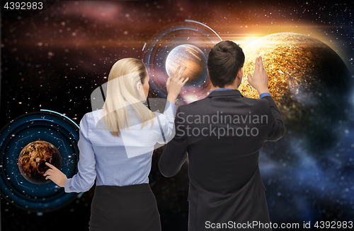 Image of businessman and businesswoman over space