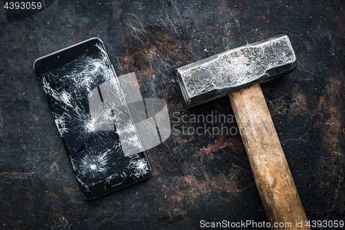 Image of Big modern smartphone with broken screen debris