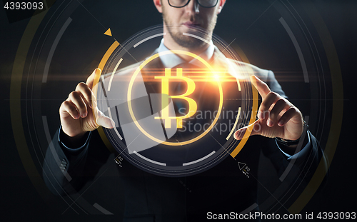 Image of close up of businessman with bitcoin hologram