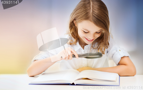 Image of happy smiling student girl reading book