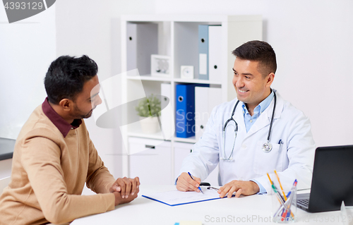 Image of happy doctor and male patient meeting at hospital