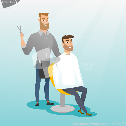 Image of Barber making haircut to young man.