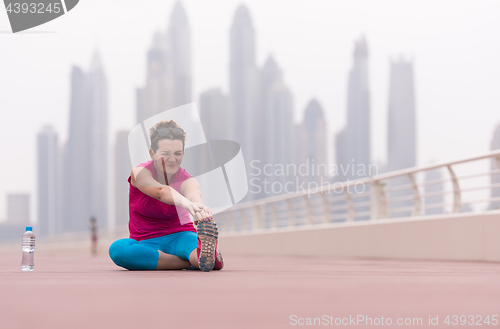 Image of woman stretching and warming up