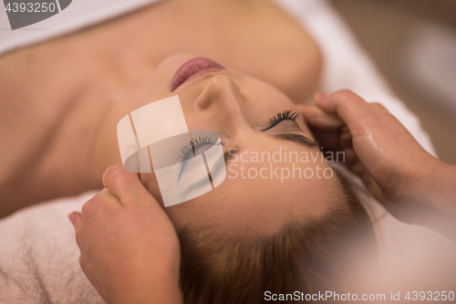 Image of woman receiving a head massage