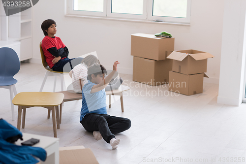 Image of boys in a new modern home