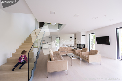 Image of little cute girl enjoying on the stairs