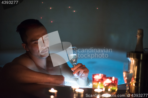 Image of man relaxing in the jacuzzi