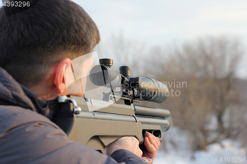 Image of Hunter with rifle ready for shoot the target