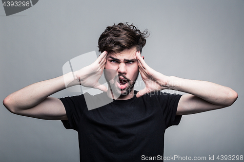 Image of Man feeling pain,  with gray background