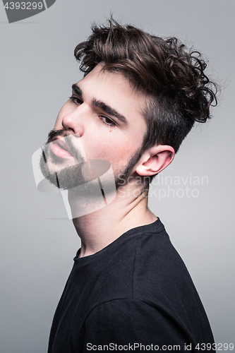 Image of Professional studio portrait of young handsome man