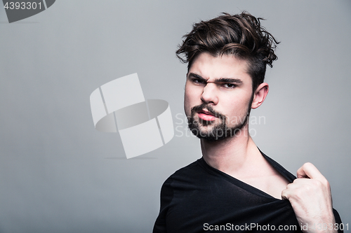 Image of Professional studio portrait of young handsome man