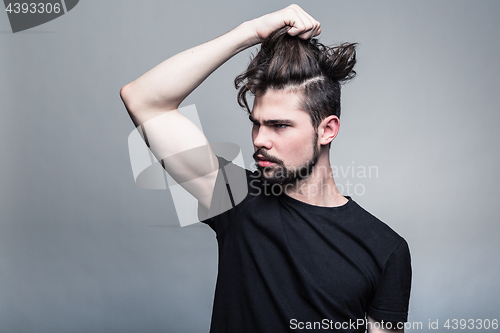 Image of Professional studio portrait of young handsome man