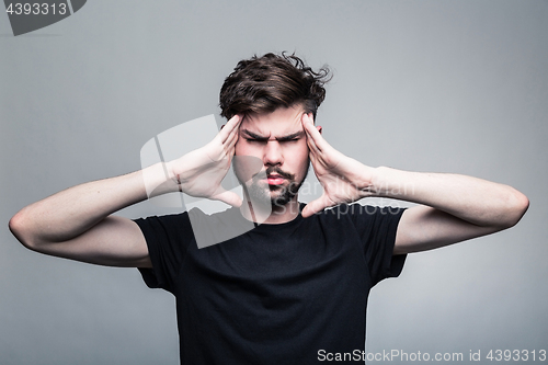 Image of Man feeling pain,  with gray background