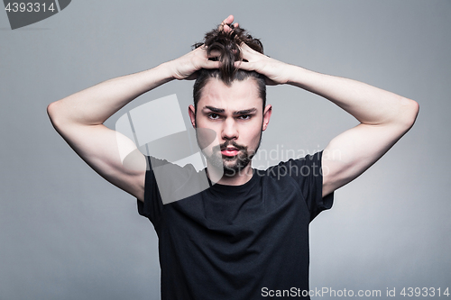 Image of Professional studio portrait of young handsome man